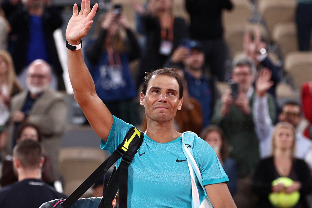 Rafael Nadal waves to the crowd after losing in the first round of Roland Garros 2024